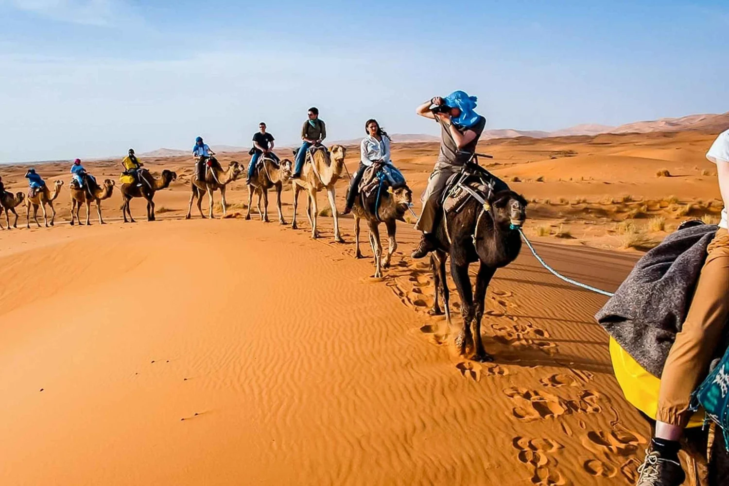 Camel ride on the Merzouga dunes at sunset